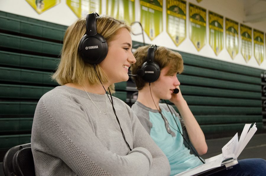 Isabelle Robles produces a live broadcast during a basketball game. She is the new Journalist of the Year.