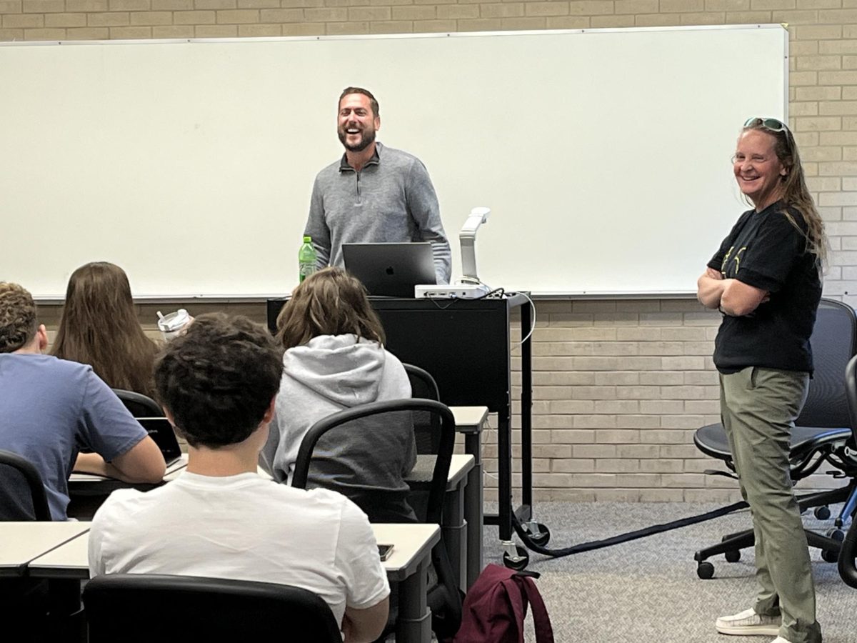 Drake Universitys Chris Snider laughs as the Prize Patrol interrupts his Friday afternoon multimedia class and surprises him with the announcement he is the 2023 Stratton Award winner.